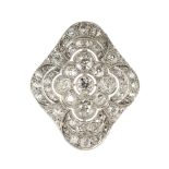 An antique Art Deco diamond scarf clip in 18ct white gold set with a central old round cut diamond