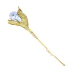 A pearl and diamond flower brooch in 18ct yellow gold set with a pearl at the centre, with
