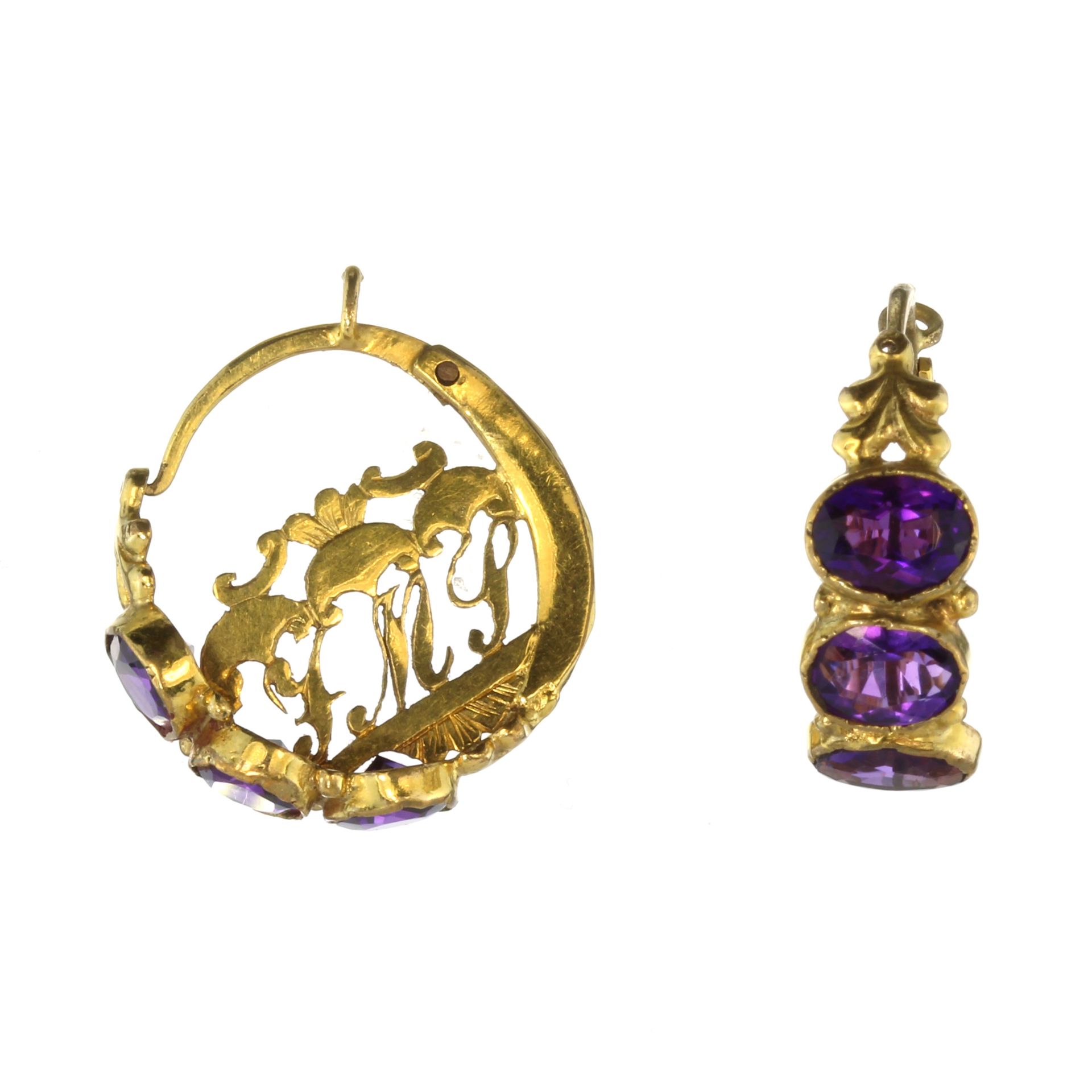 A pair of antique Georgian amethyst earrings in high carat yellow gold each designed as a full