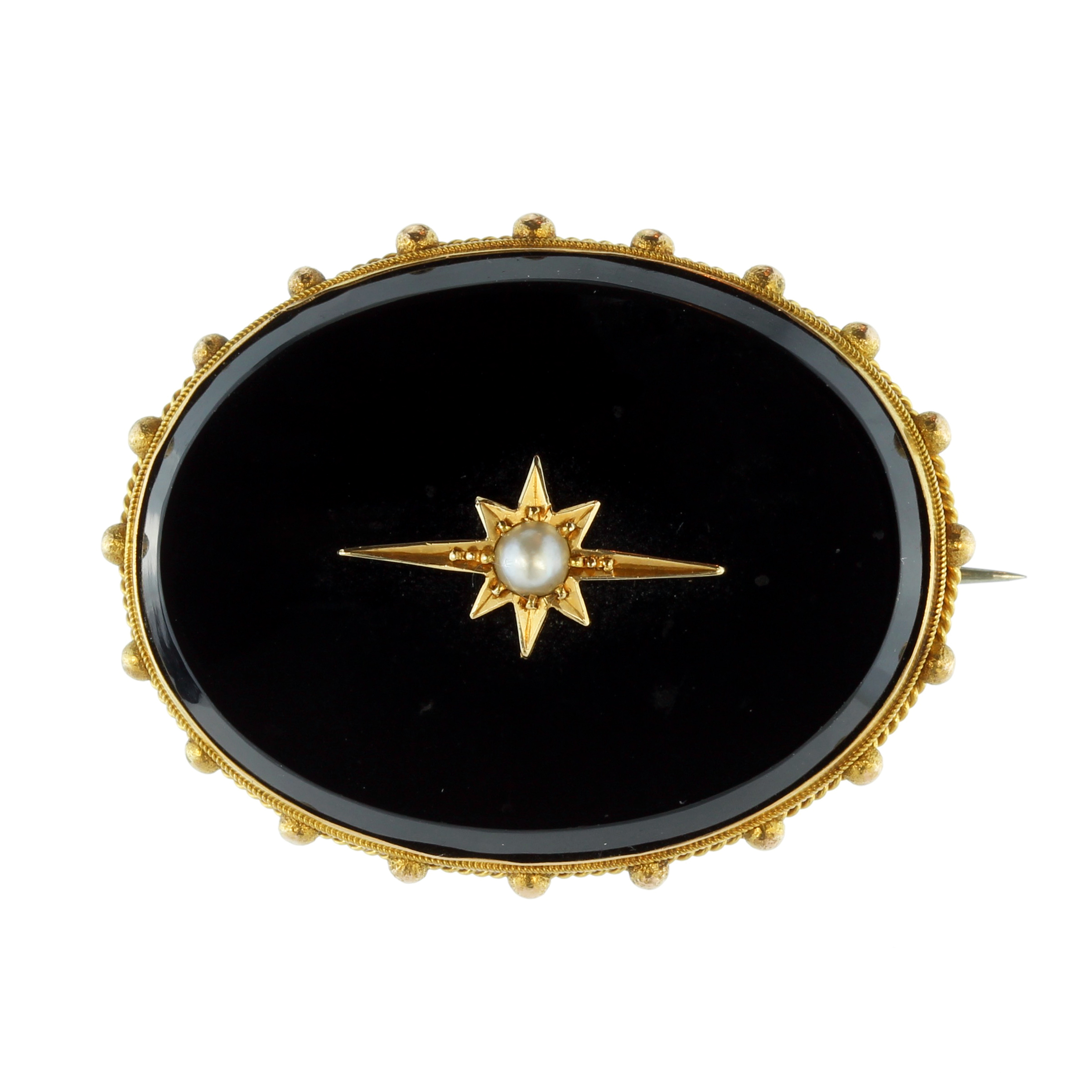 An antique Victorian onyx and pearl mourning brooch in high carat yellow gold designed a large