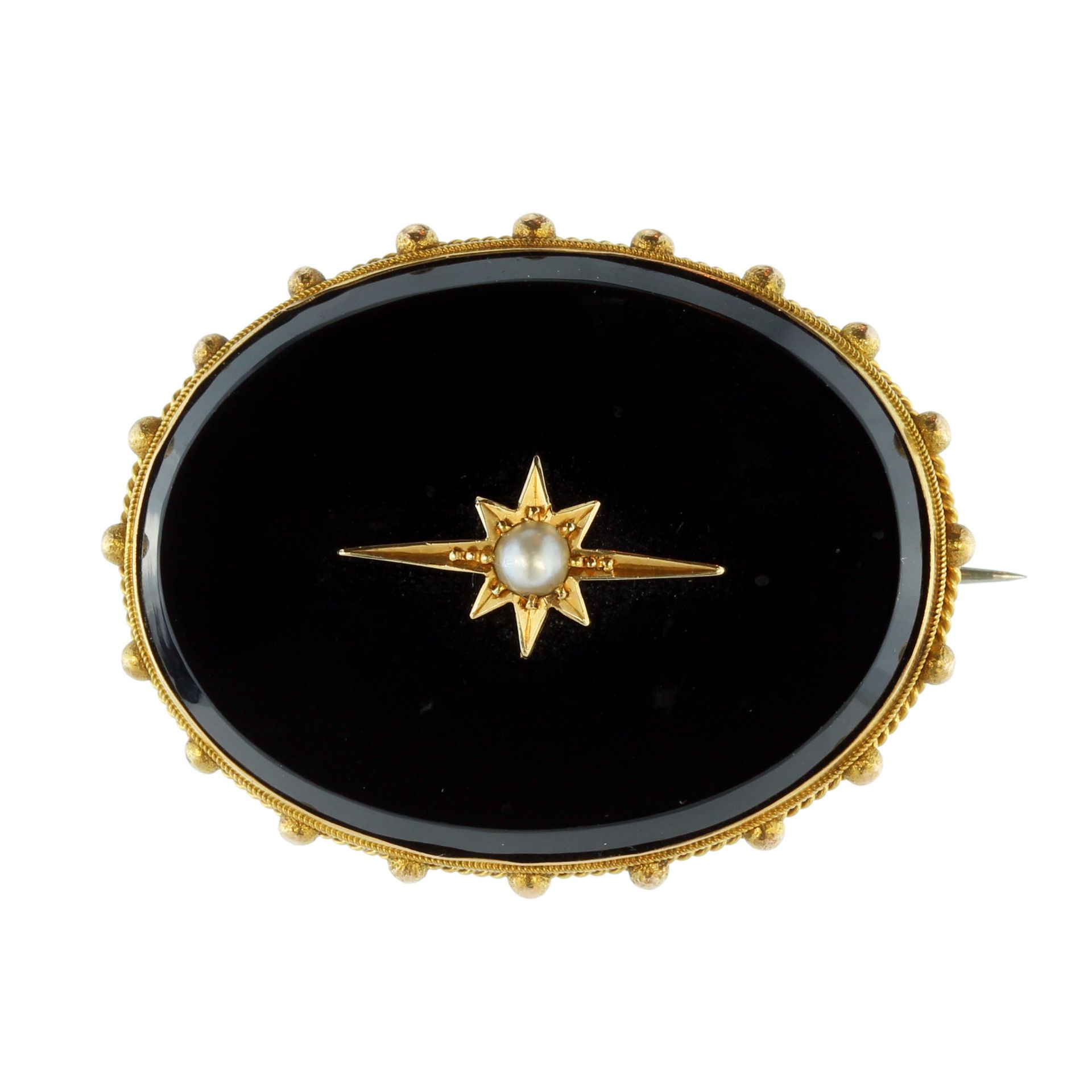 An antique Victorian onyx and pearl mourning brooch in high carat yellow gold designed a large