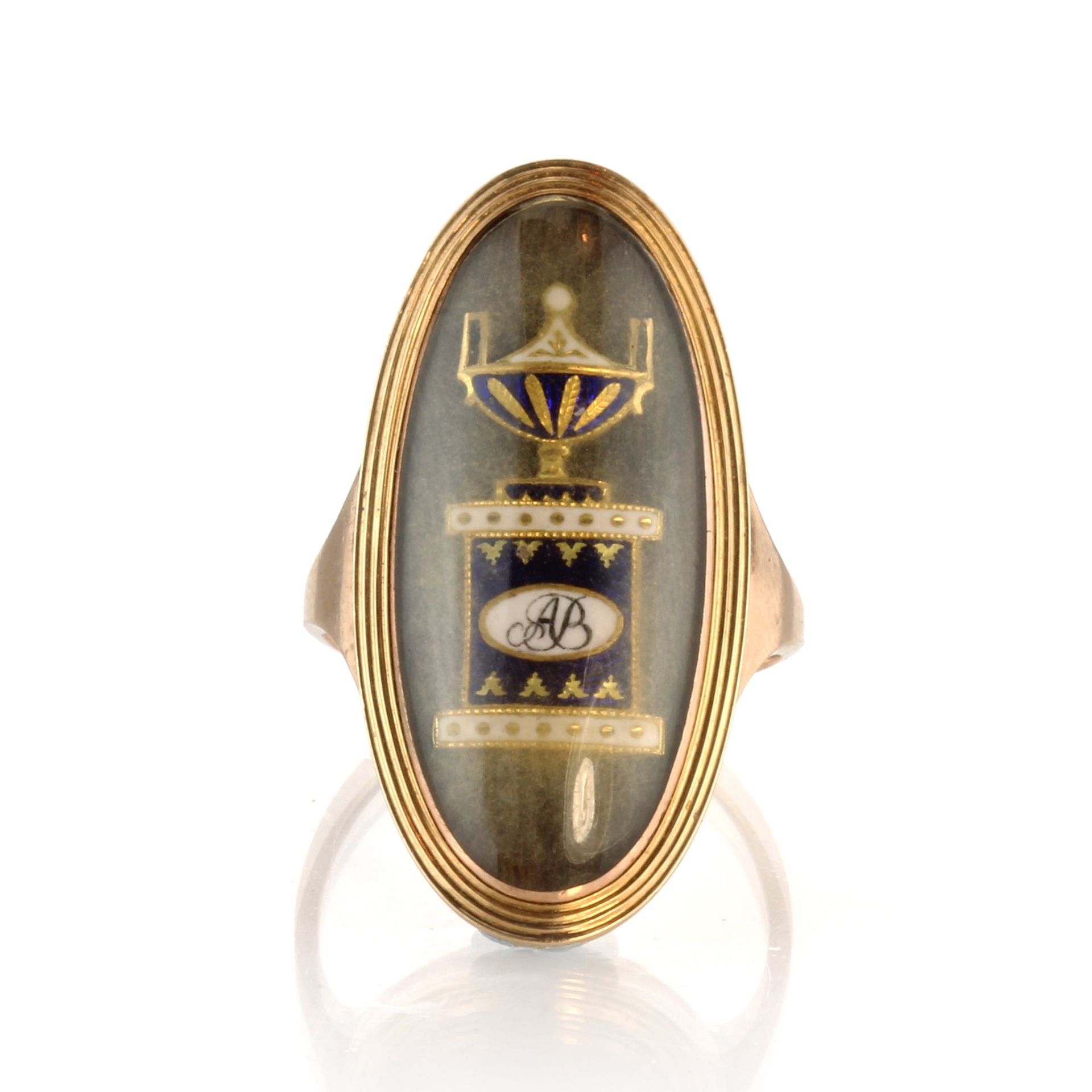 An antique Georgian hairwork mourning urn ring in high carat yellow gold designed as a large