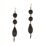 A pair of antique jet drop earrings each designed as a large, reeded teardrop piece of jet,