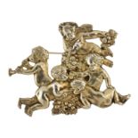An antique Sterling Silver cherub brooch depicting five bacchanalian cherubs cavorting among