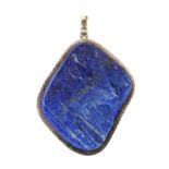 A naturalistic lapis lazuli pendant in sterling silver set with a large piece of rough lapis