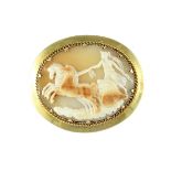 An antique Victorian cameo brooch in high carat yellow gold designed as an oval cameo carved in