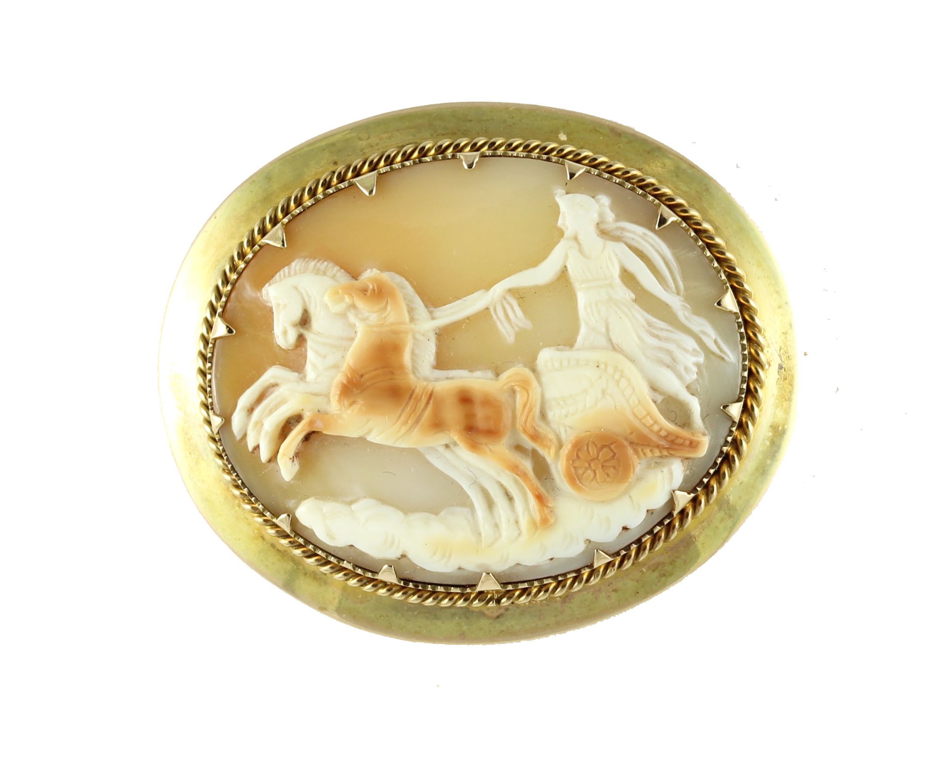 An antique Victorian cameo brooch in high carat yellow gold designed as an oval cameo carved in