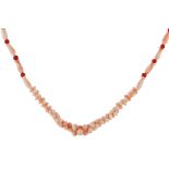 A coral and angel coral bead necklace designed as a single row of graduated interlocking angel coral