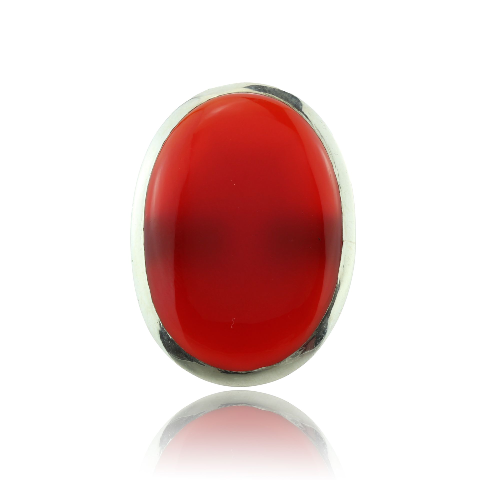 A large carnelian dress ring in sterling silver set with a large oval carnelian cabochon measuring