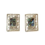 A vintage pair of mother of pearl / abalone clip earrings in silver each designed as a rectangular
