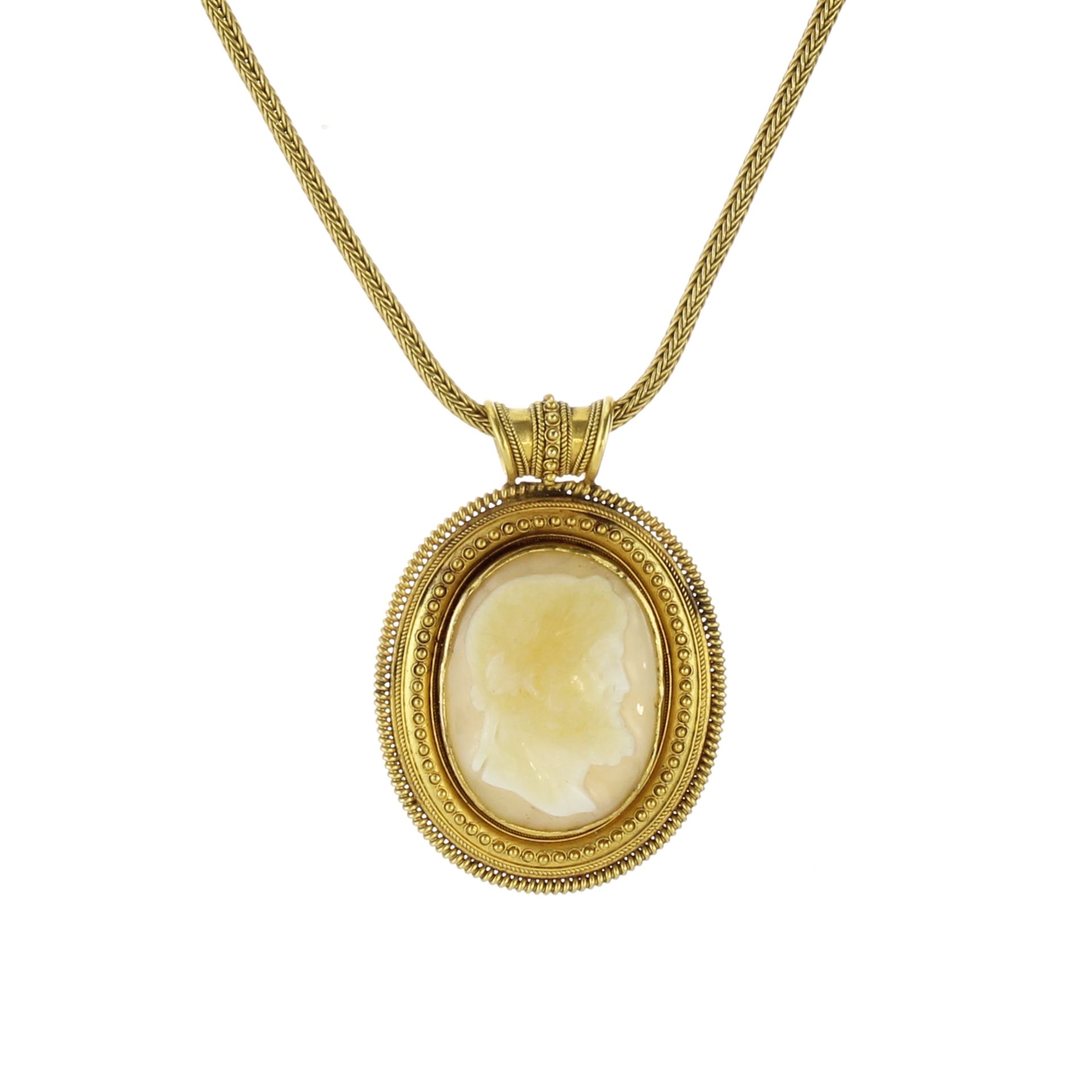 A rare antique 19th Century Etruscan revival cameo pendant in high carat yellow gold set with a