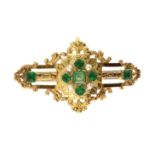 An antique 19th Century French paste emerald and pearl brooch in high carat yellow gold set with