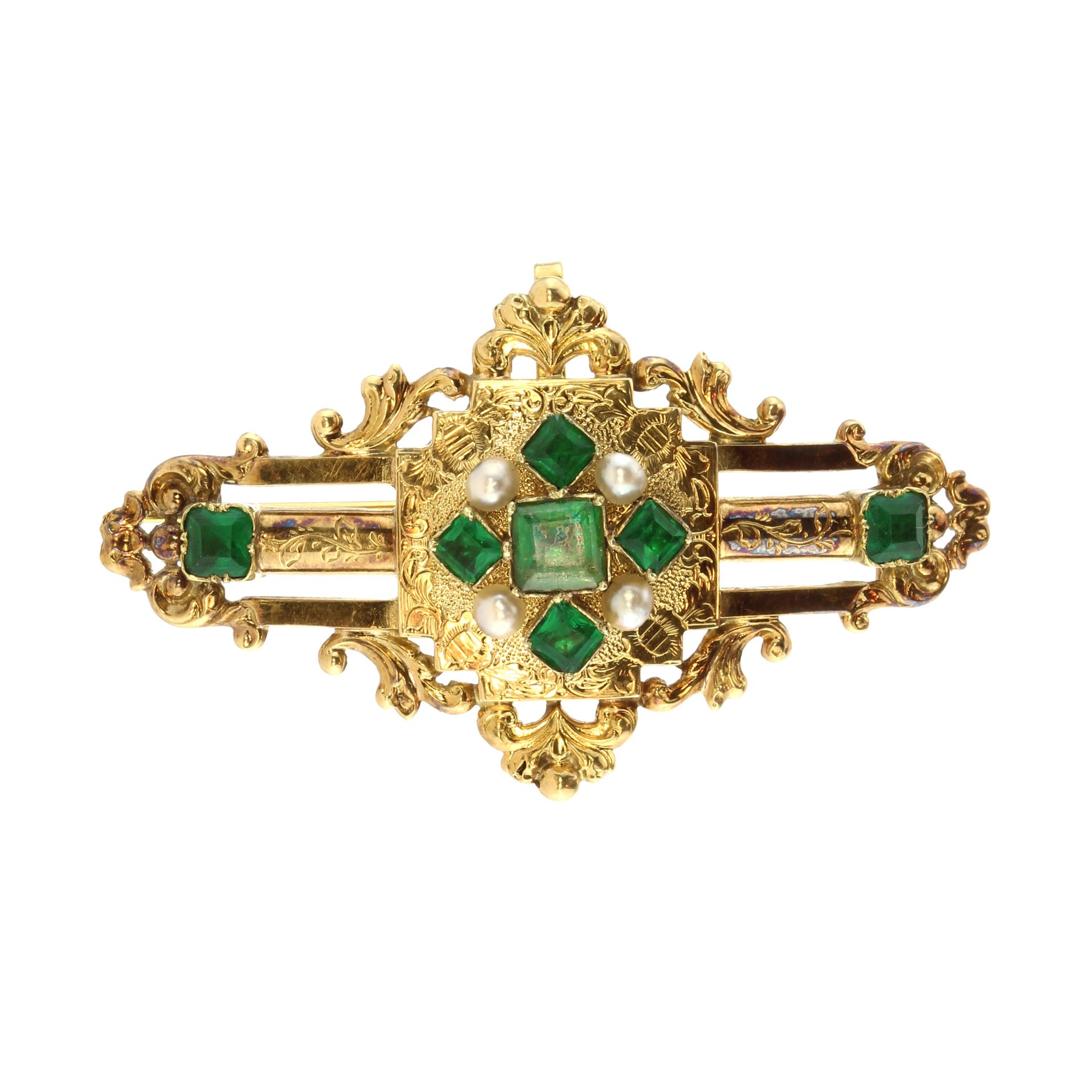 An antique 19th Century French paste emerald and pearl brooch in high carat yellow gold set with