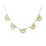 An antique French Art Nouveau pearl necklace in 18ct yellow gold designed as five floral art nouveau