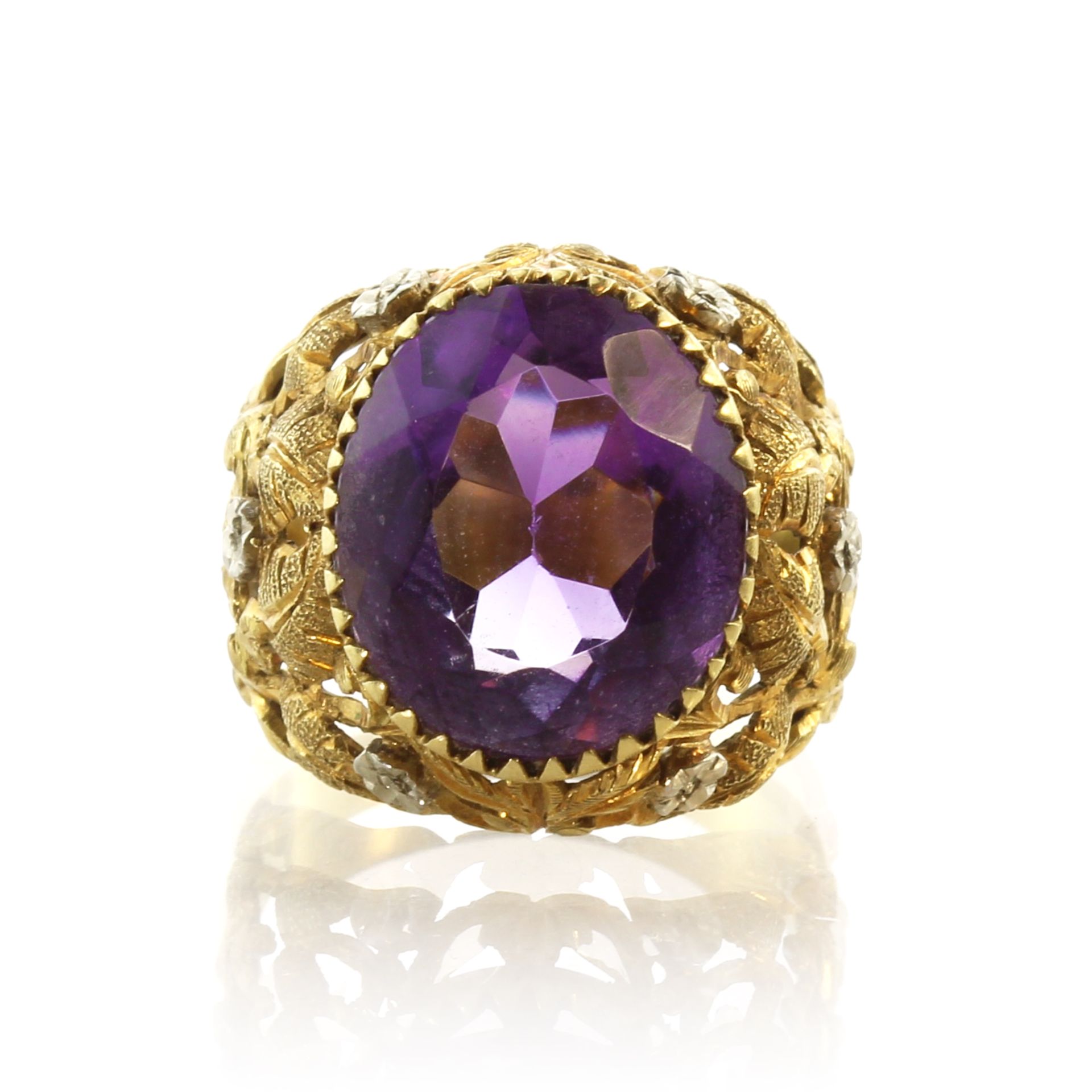 An amethyst dress ring in 18ct yellow gold set with a large oval cut amethyst set in a bombe style