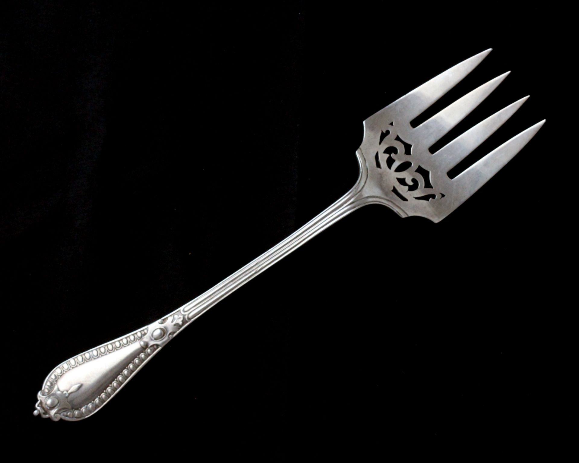 An antique Victorian Sterling Silver Grecian pattern meat fork by George Adams, London 1870.
