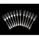 A set of twelve antique George III Sterling silver dinner forks by Thomas Chawner, London 1774-76 in