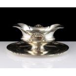 An antique French Silver sauce tureen by Tetard Freres, Paris circa 1905 the navette body with