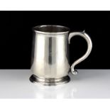 An antique George I Sterling Silver pint mug by Richard Green, London 1727 of baluster form on a