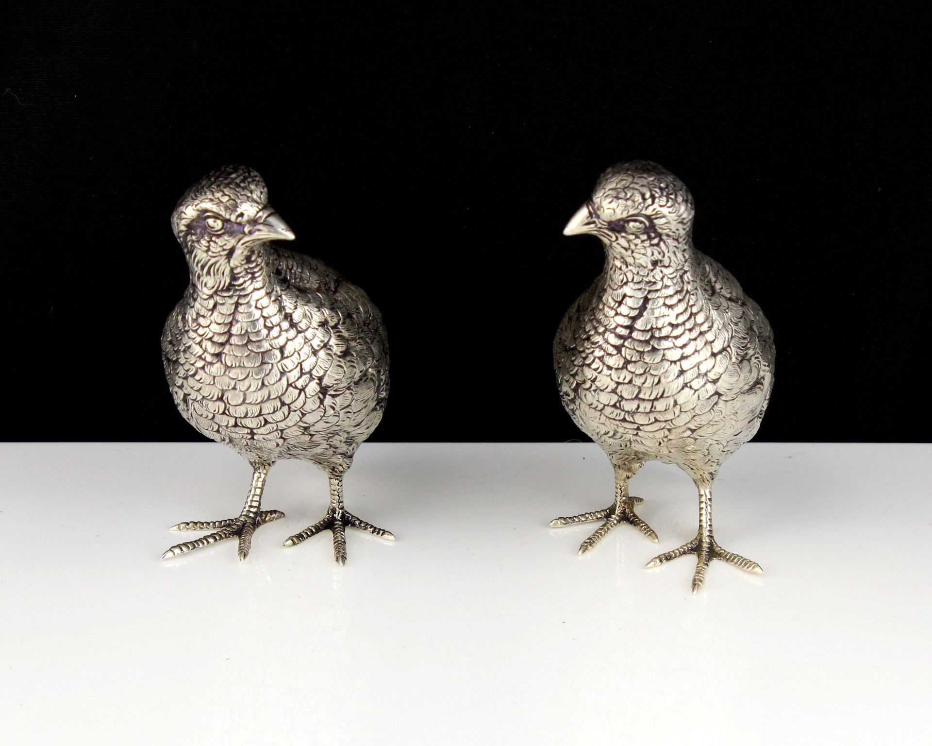 A pair of antique German Sterling Silver statues of grouse circa 1890 each modeled as a standing