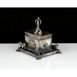 A jewelled silver Judaica box of rectangular form, on a larger base decorated with lions, raised