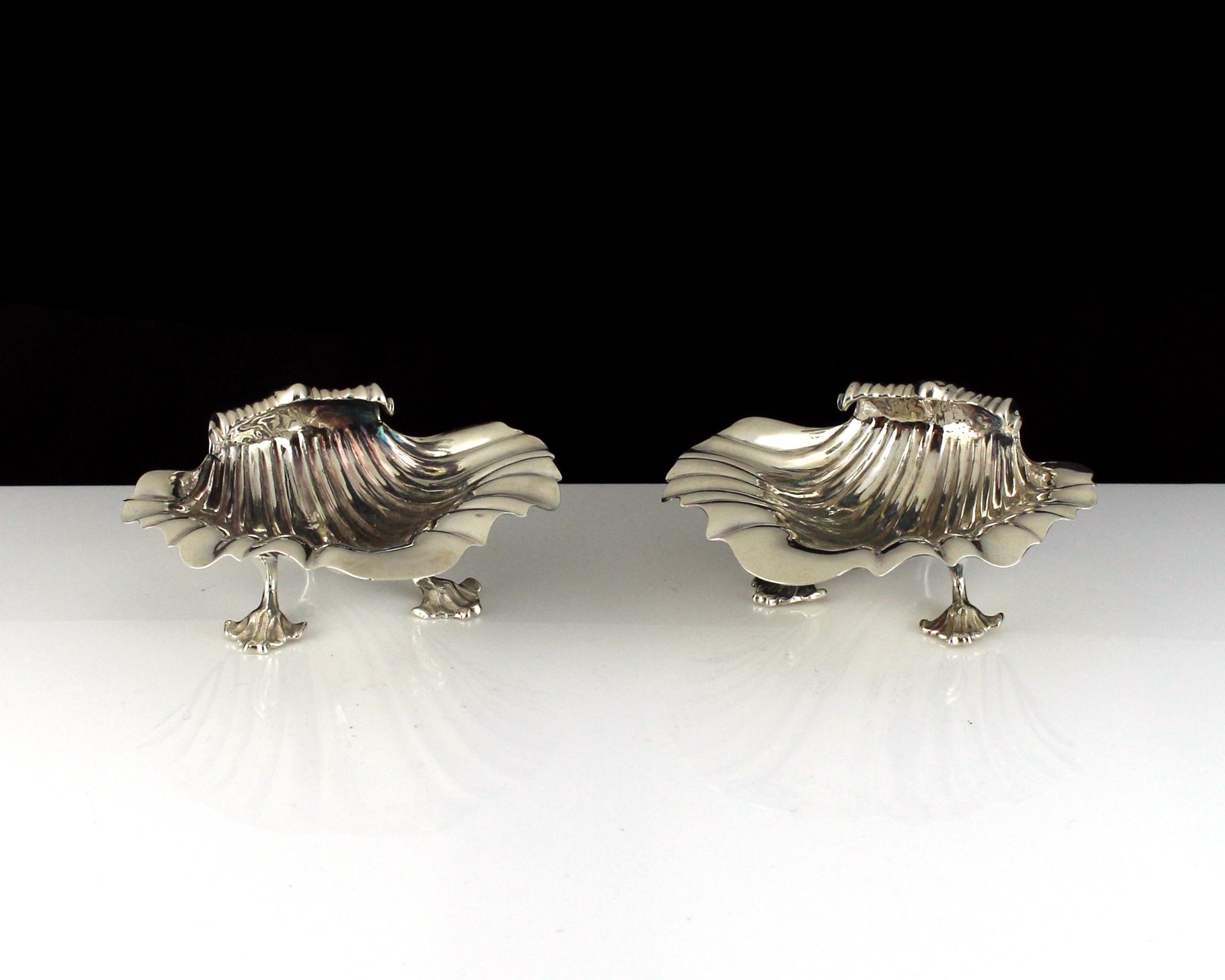 A pair of antique George IV Sterling Silver scallop shell salt cellars by George Fox, London 1827