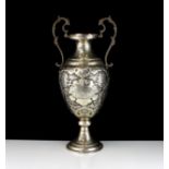An antique late 19th Century Persian Silver vase of typical form, the rounded body on a pedestal