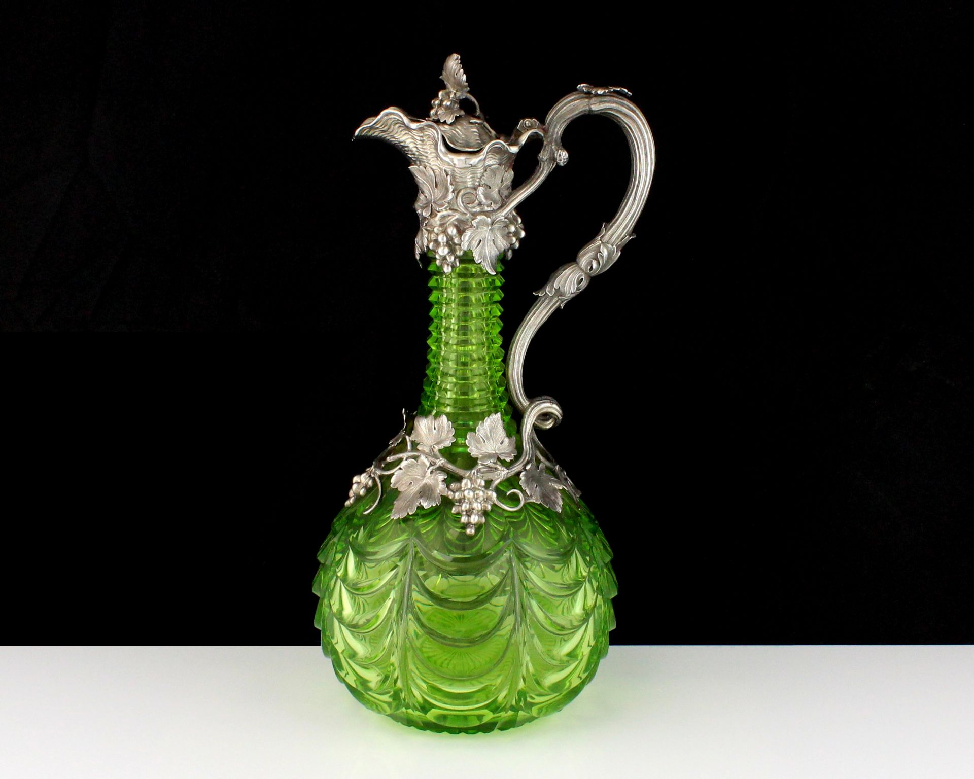 An antique Victorian Sterling Silver mounted claret jug by the Barnard Brothers, London 1839 the