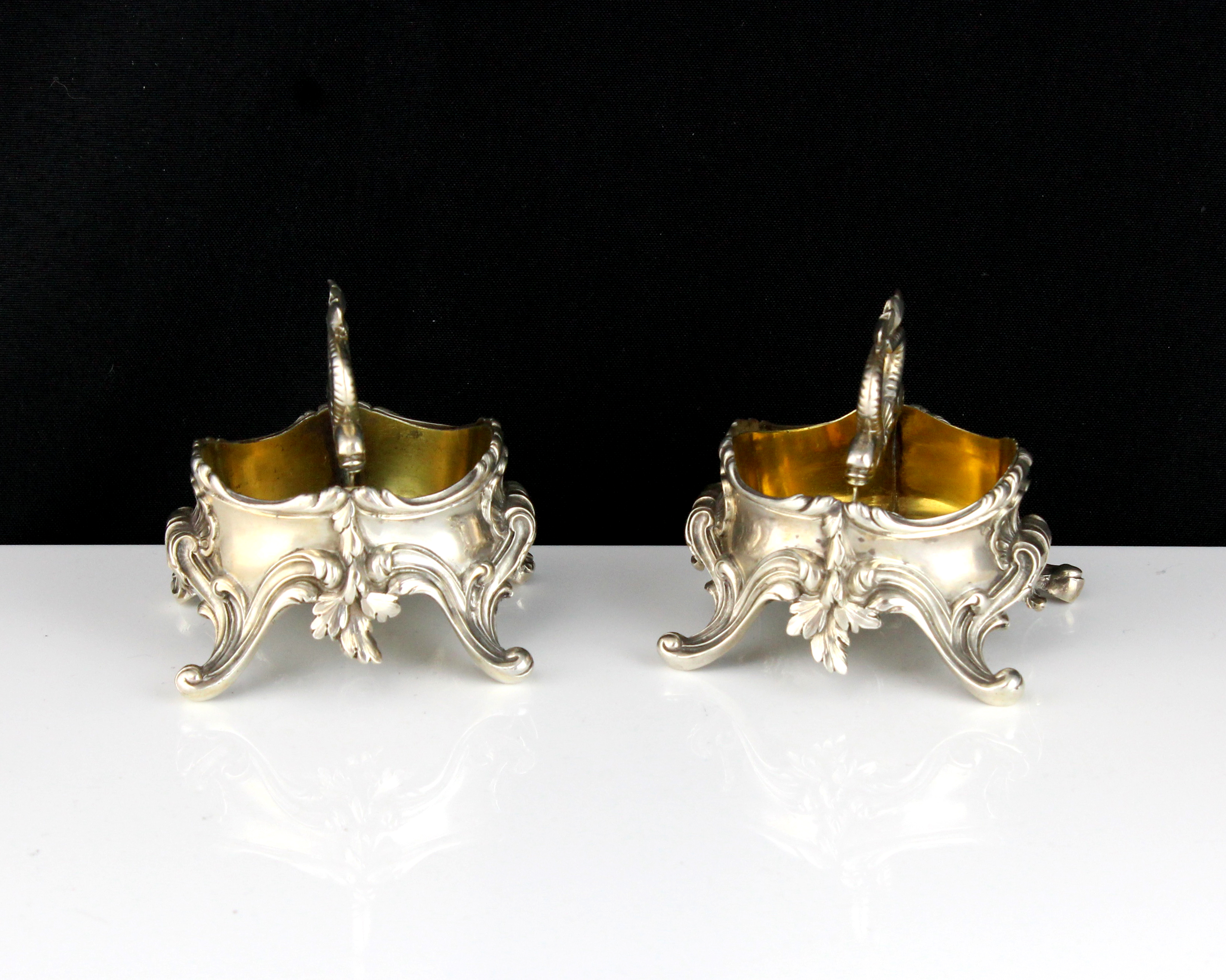 A pair of antique 19th Century French Silver salt / condiment cellars by Durand each of oval form on