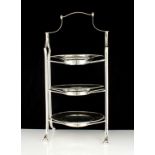 A large Silver plated cake stand designed with three tiers. Height 51cm / 20".