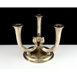 A WMF Silver plated candelabra designed as three tapering stems joined in the centre atop a circular
