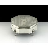 An antique George V Sterling Silver jewellery box by Henry Matthews, Birmingham 1912 of octagonal