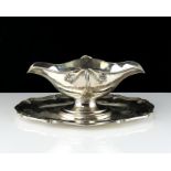 An antique French Silver sauce tureen by Edmond Tetard, Paris circa 1890 the navette body with