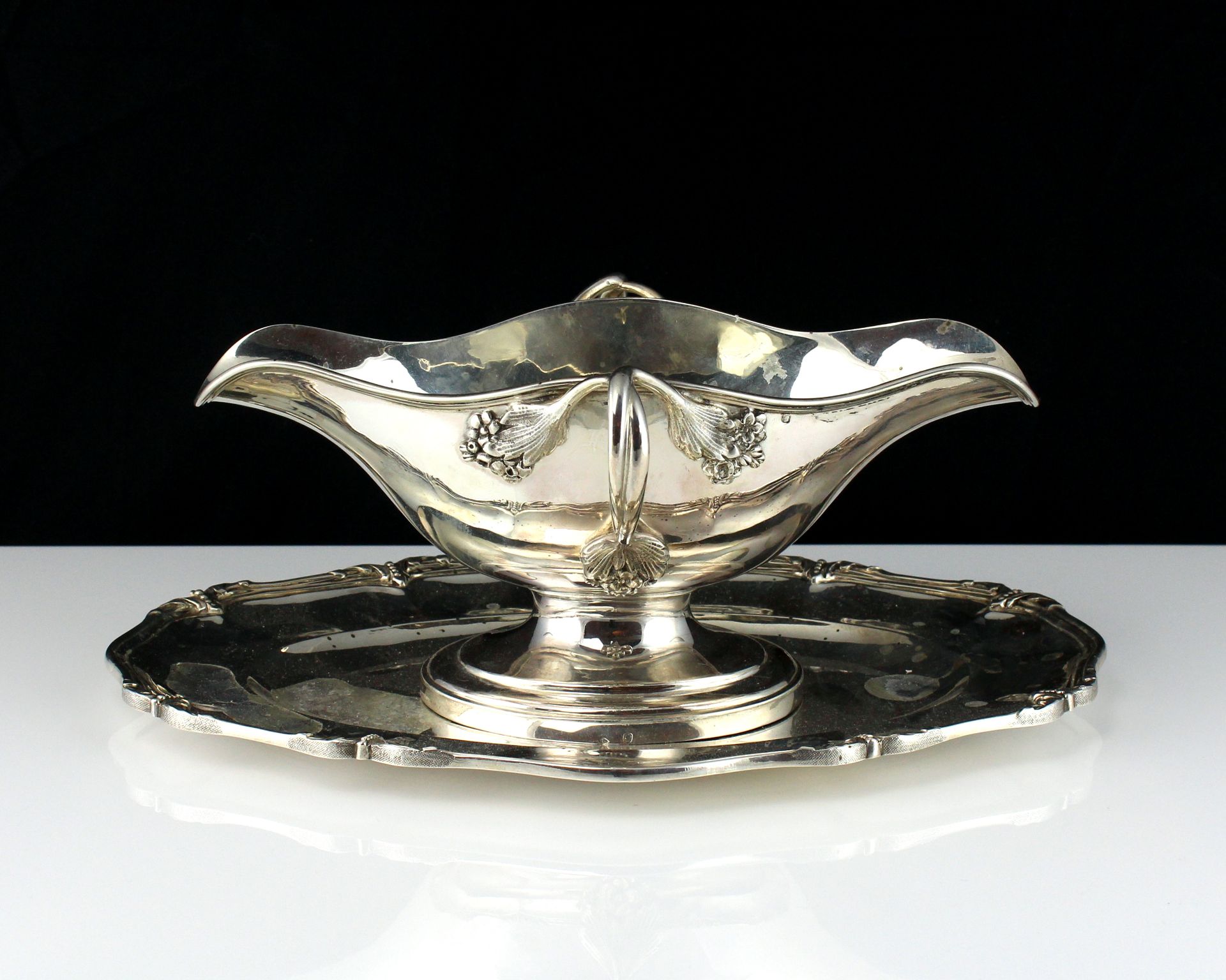 An antique French Silver sauce tureen by Edmond Tetard, Paris circa 1890 the navette body with