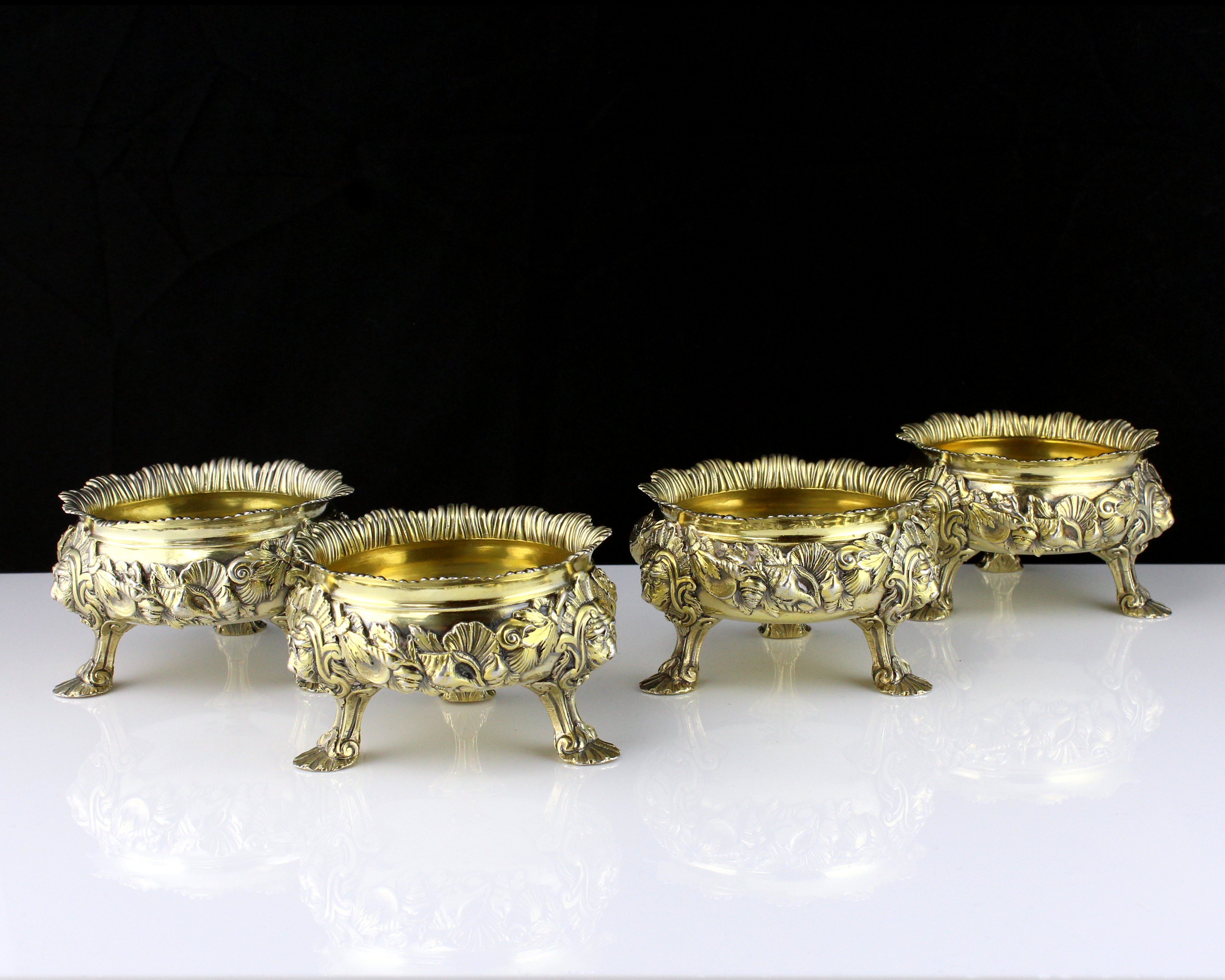 A set of four antique George II Sterling Silver gilt salt cellars by Peter White, London 1746 of
