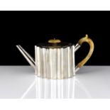 An antique Victorian Sterling Silver bachelor's teapot by William Comyns, London 1867 of navette