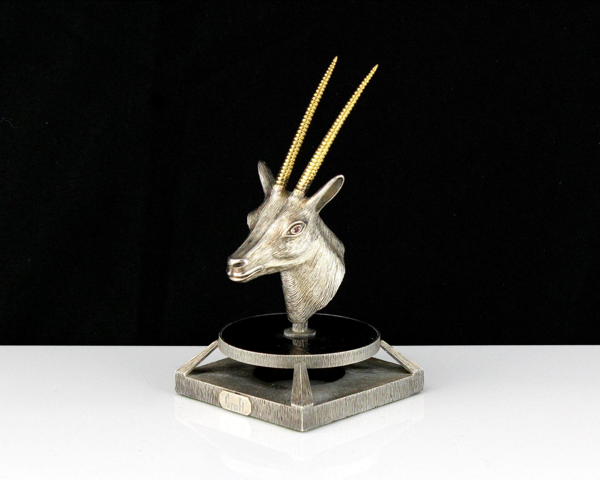 A jewelled silver oryx head statue signed Graff designed as the head of an oryx cast in silver