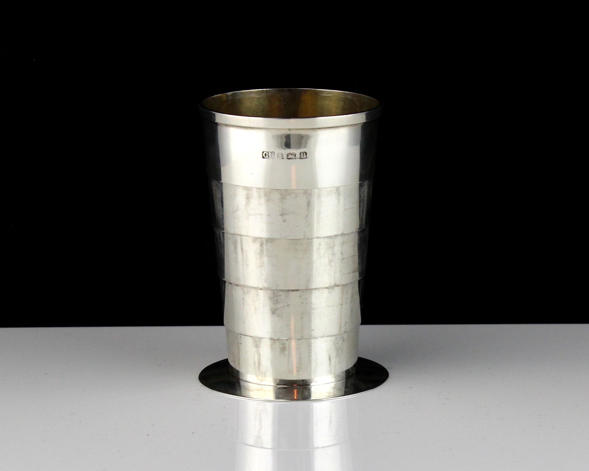 A novelty antique Sterling Silver collapsible cup by George Unite, Birmingham 1939 on a circular