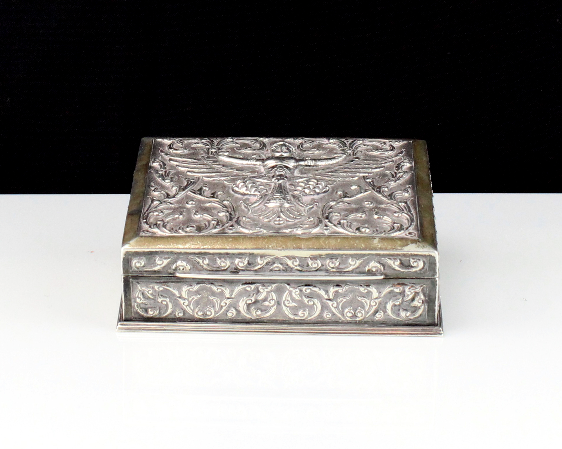 A mid 20th Century Siamese / Thai Sterling Silver cigar box of rectangular form with high relief