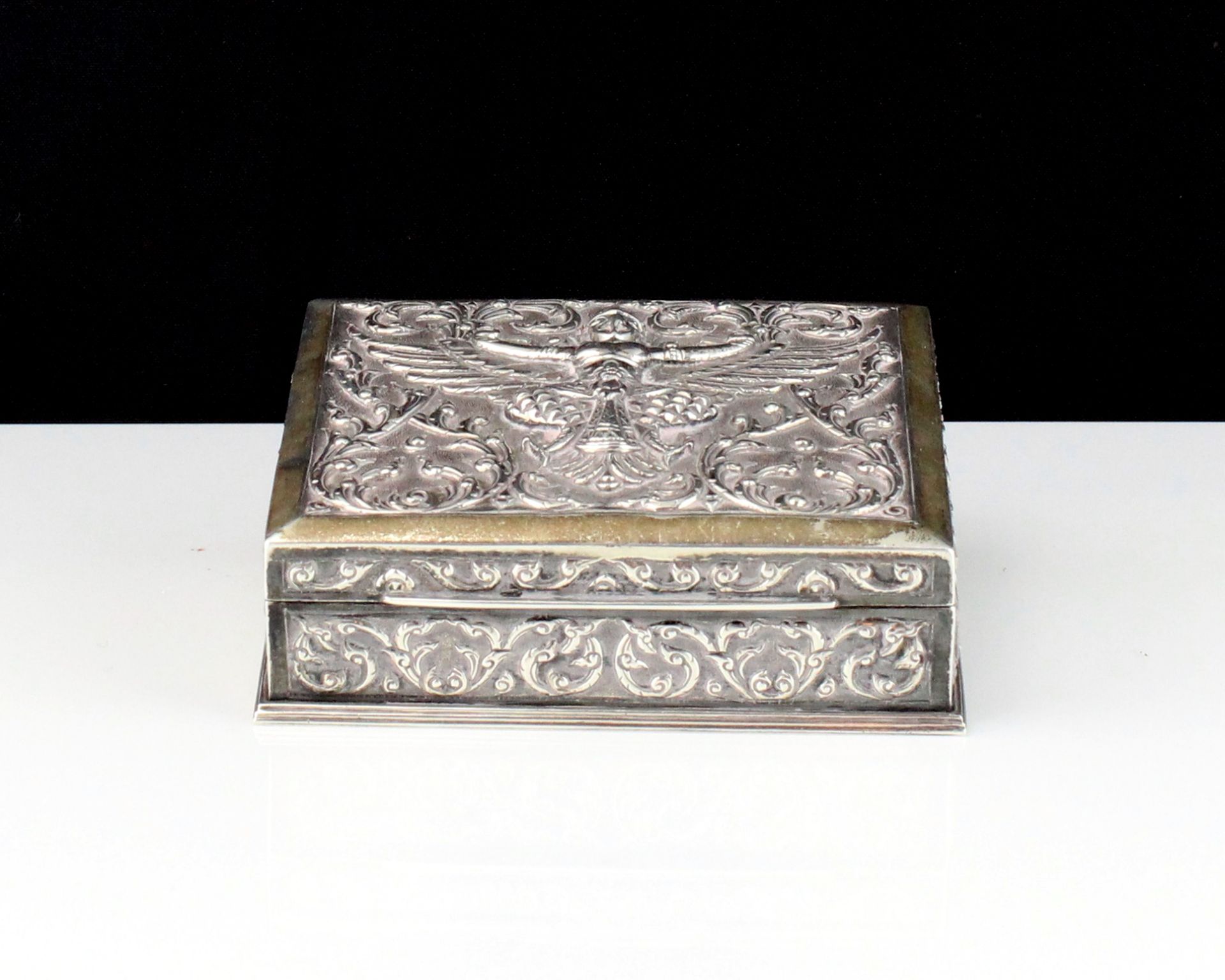 A mid 20th Century Siamese / Thai Sterling Silver cigar box of rectangular form with high relief