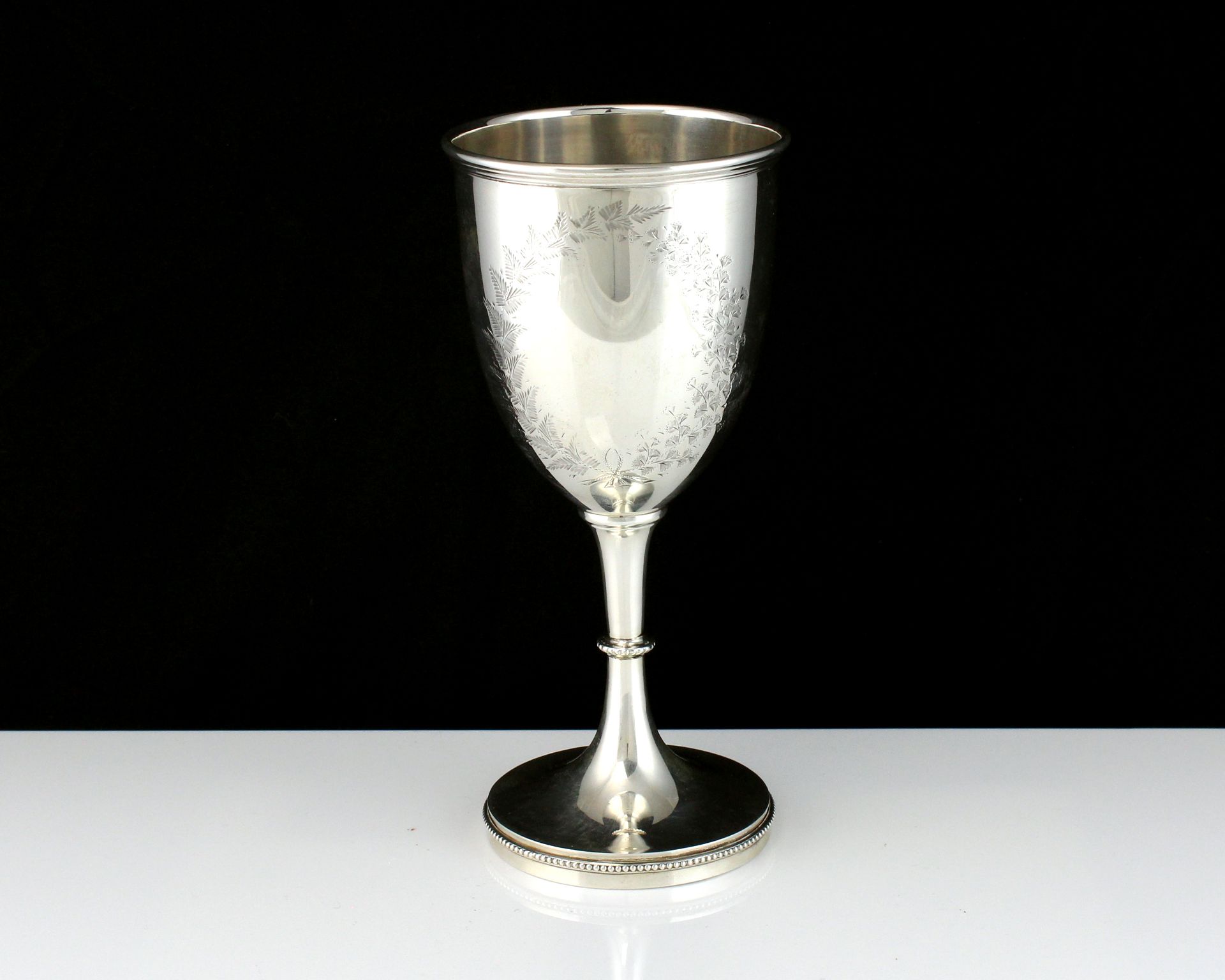 An antique George V Sterling Silver goblet by William Devenport, Birmingham 1910 of typical form,