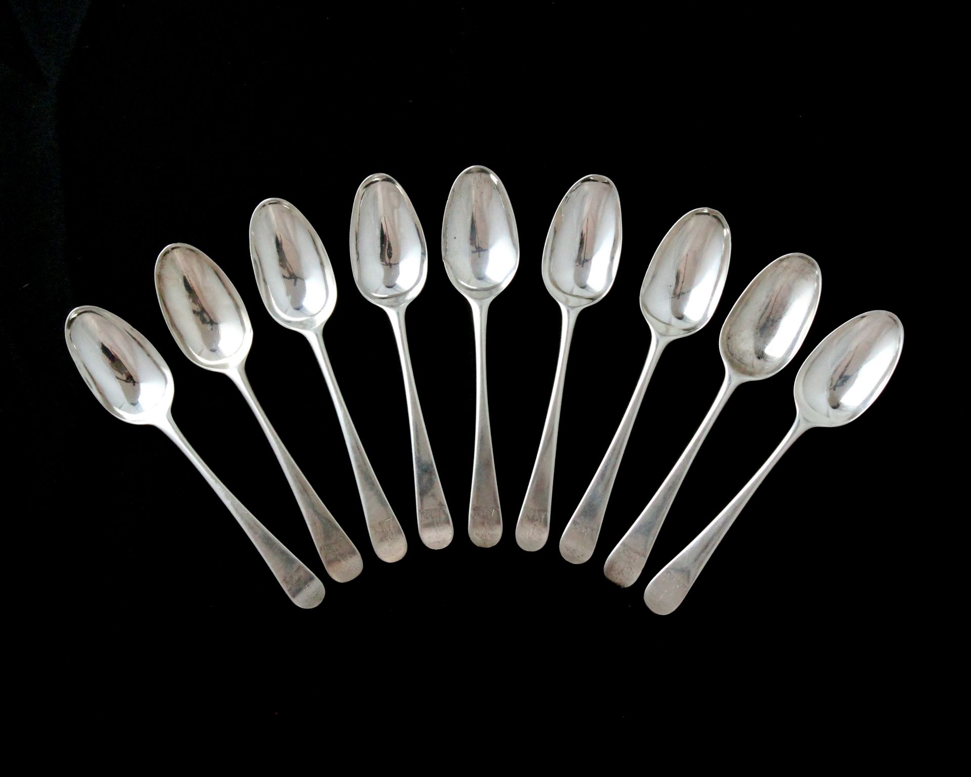 A set of nine antique George II Sterling Silver dessert spoons by Isaac Callard, London 1759 in