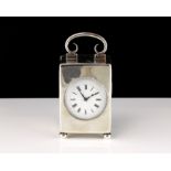 An antique Edwardian Sterling Silver carriage clock by William Comyns, London 1905. Of upright,
