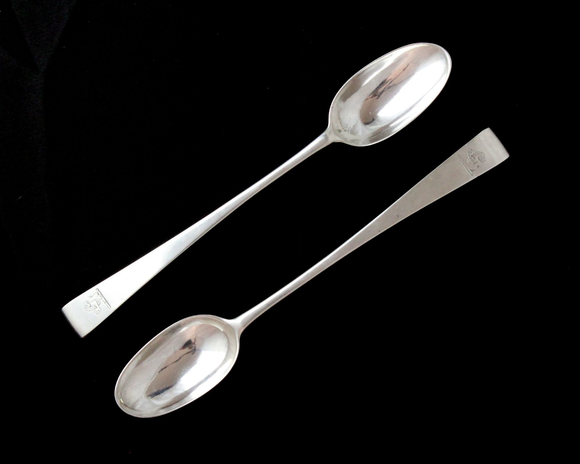 A rare pair of antique George II / III provincial Irish Sterling Silver hook end basting spoons by