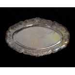 An antique French Silver meat tray / serving platter circa 1890 of elongated oval form with raised