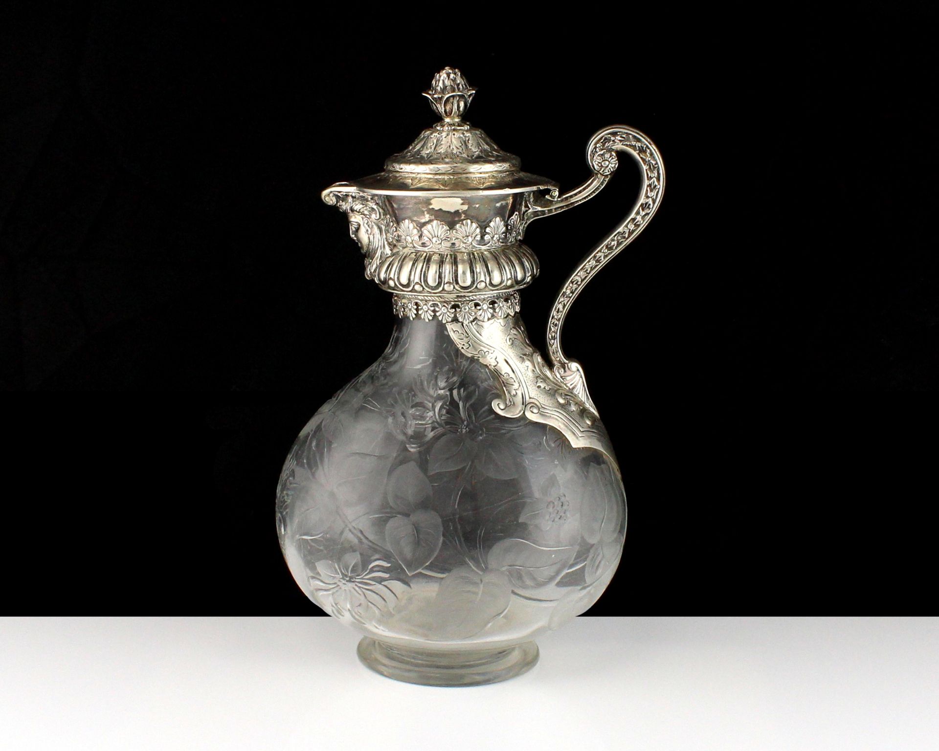 An antique Victorian Sterling Silver mounted claret jug by Mappin & Webb (J N Mappin), London 1886