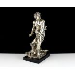 An Italian Silver sculpture after David by Gian Lorenzo Bernini depicting David with slingshot about