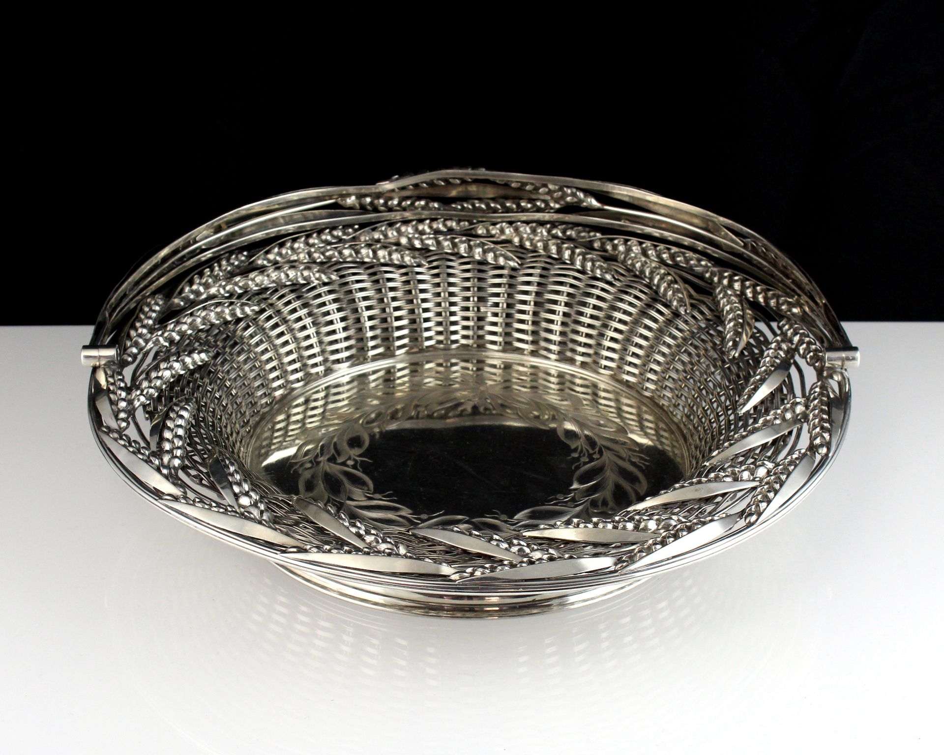 An antique Victorian Sterling Silver swing handled bread / cake basket by Thomas Bradbury & Son,