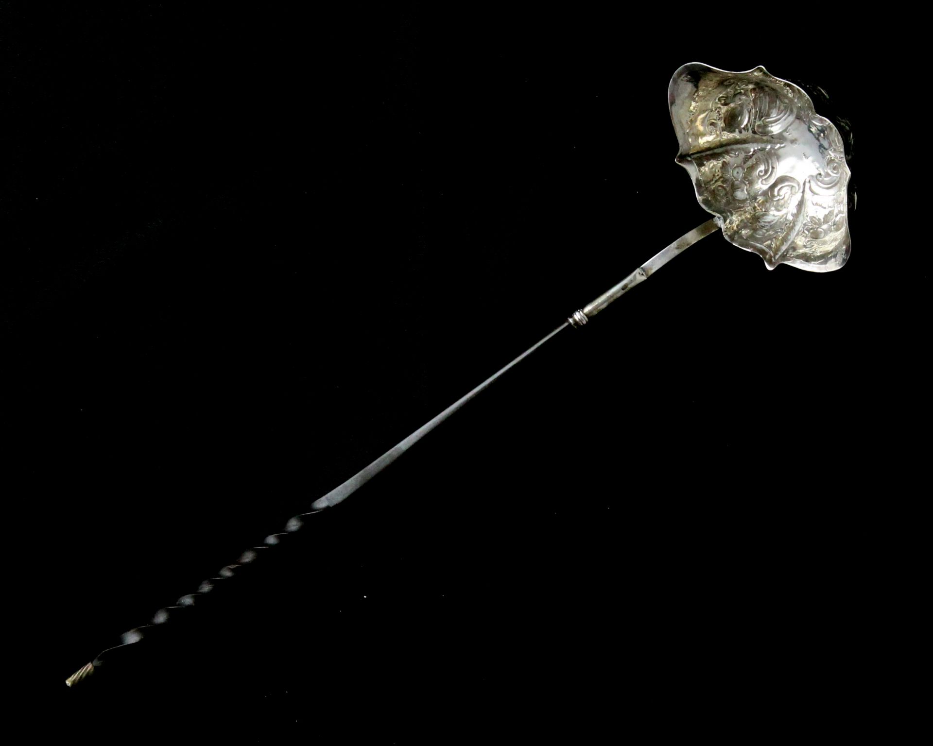 An antique George II Sterling Silver toddy ladle circa 1740 with stylised serpentine bowl