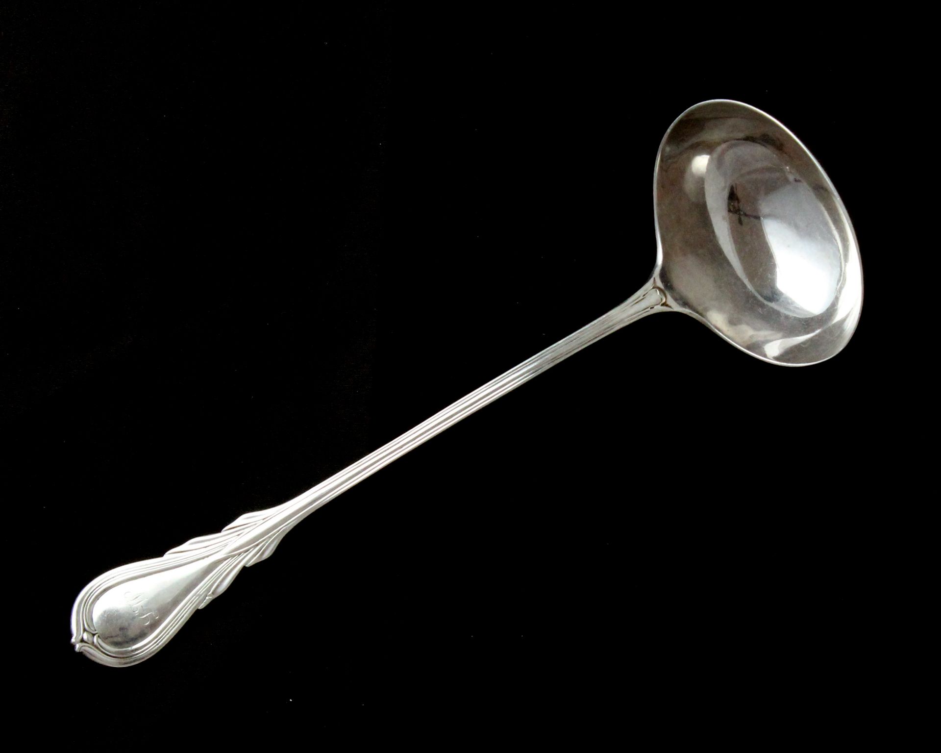 An antique Victorian Lily pattern sauce ladle by George Adams, London 1856 with design patent